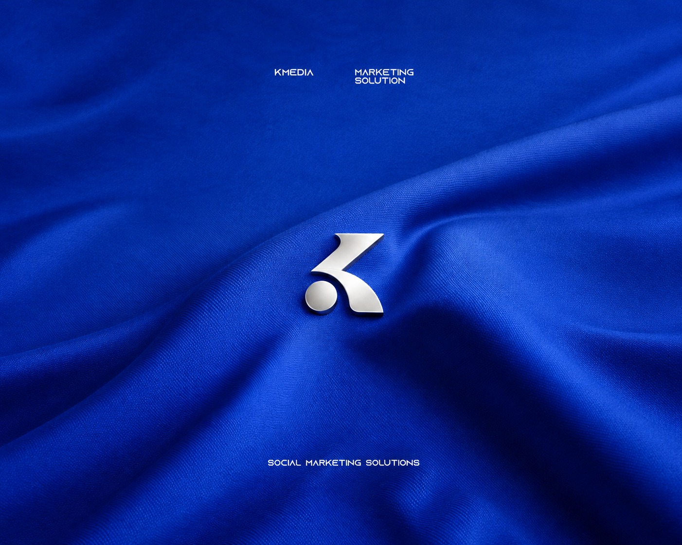 K Media — Social Marketing Solutions mark on blue silk